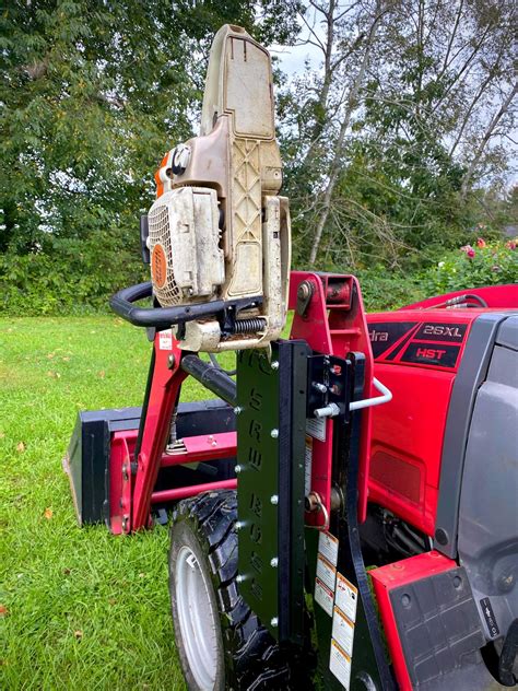 skid steer chainsaw holder|hydraulic chainsaw for bucket truck.